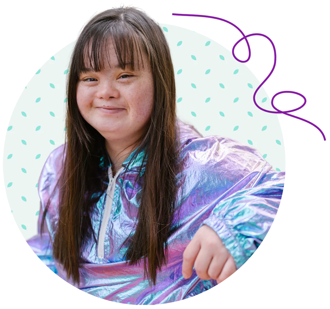 A young woman with down syndrome is smiling
